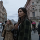 Gemma Chan's Sersi stands in the busy crosswalks of London's Piccadilly Circus in Marvel's Eternals.